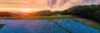 Photovoltaik-Freifläche bei Sonnenuntergang